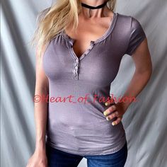 Super Cute Little Short Sleeve Top With Adjustable Button Neckline. Great Top For Daily Wear! Super Stretchy And Comfortable Fabric. Purplish Gray Color 95% Rayon, 5% Spandex Please See Measurements. Small Armpit To Armpit- 14" Length (Shoulder To Hem)- 23" Medium Armpit To Armpit- 15" Length (Shoulder To Hem)- 23.5" Large Armpit To Armpit- 16" Length (Shoulder To Hem)- 24" Model: 5'6, 118 Lbs, 25" Waist, 35" Hips, 32d. Wearing Size Small. Pocket Tee Shirts, Womens Black Shorts, Tops Short Sleeve, Henley Tee, Ladies Tee Shirts, Short Sleeve Pullover, Pullover Shirt, Striped Tee, Striped Shorts