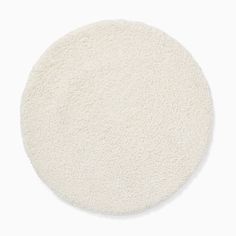 a white round rug on a white background