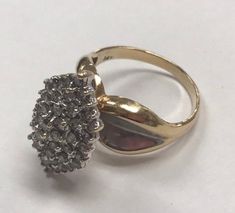 "VINTAGE 14k Two Tone Gold 1.25 CTW Diamond Cluster Cocktail Ring Size 7.25 Beautiful and unique 14k yellow and white gold band with approximately 50 round .2 and .3 ct sparkling diamonds! Ring is a size 7.25, weighs 6.2 grams of 14k gold. Diamond face measures approximately 3/4\" x 1/2\" wide! This ring is very unique and pretty! I am liquidating my huge jewelry collection, this one has to go! Will make a PERFECT gift! INSURANCE/delivery confirmation included in shipping" Vintage Pear-shaped Diamond Cut Ring, Vintage 14k Gold Cluster Jewelry, Vintage White Gold Pear-shaped Rings, Vintage Yellow Gold Cluster Jewelry, Vintage 14k Gold Cluster Ring With Diamond Accents, Vintage Cluster Ring In 14k Gold, Vintage 14k Stamped Cluster Rings, Vintage Marquise Cut Cluster Ring Stamped 14k, Vintage Multi-stone Diamond Ring In Yellow Gold