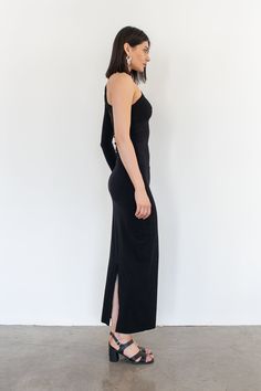 Our newest basic, the Jessi dress is a one armed fitted silhouette featuring a fold over chest detail and the length hitting at the ankle. Black - 90% Viscose / 10% Spandex Sleeve is on right side. Hand wash only and lay flat too dry. Cris is 5'9 / 175 cm and wearing a size 1 which is equivalent to a size small. Fitted Silhouette, Fold Over, Right Side, Timeless Pieces, Lay Flat, Hand Wash, Spandex, Wardrobe, How To Wear