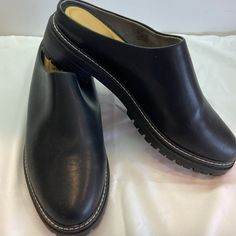 Size 11 Black Lug Sole Mules/Clogs Never Worn. Extreme Cushion Inside. Black Closed Toe Slip-ons With Leather Footbed, Leather Flat Platform Clogs, Black Slip-ons With Medium Width And Round Toe, Black Almond Toe Slip-ons With Cushioned Footbed, Black Clogs With Leather Footbed For Work, Black Closed Toe Slip-ons With Leather Sole, Black Closed Toe Slip-ons With Cushioned Footbed, Black Leather Sole Slip-ons With Closed Toe, Classic Synthetic Clogs With Leather Sole