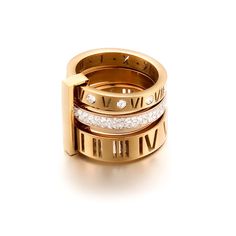 Elevate your accessory game with our Roman numeral triple stack rings. A timeless and classic piece, perfect for adding a touch of elegance to any outfit. Order now and make a statement and experience the ultimate sophistication in accessories! hypoallergenic gold stainless steel sizes left, 9 & 10 Jewelry care: avoid contact with harsh chemicals like soap, chlorine water, perfume and lotions Roman Numeral Ring, Nail Bangle, Letter Ring, Rhinestone Ring, Finger Rings, Magnetic Bracelet, Wild Rose, Timeless Treasures, Stainless Steel Rings