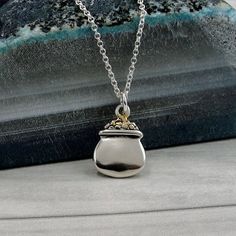 "This Pot of Gold necklace comes on a sterling silver chain that is available in different lengths. Please choose your desired length from the drop-down menu when placing the item in your shopping cart.  { CHARM DETAILS } ★ Material: .925 Sterling Silver ★ Finish Color: Silver ★ Measurements: 1/2\" x 5/8\" ★ Dimensions: Double-sided ★ Made in the USA { SIMILAR ITEMS }  More luck themed items available from my shop: https://www.etsy.com/shop/treasuredcharms/search?search_query=lucky { GIFT OPTIONS} Gift boxes are available at no additional cost and can be added from the drop-down menu during checkout.   You can mark it as a gift, add a gift message, and send it directly to a recipient by entering their address in the 'shipping address' during checkout.  Receipts with price information are n Elegant Sterling Silver Good Luck Charm Necklace, Good Luck Sterling Silver Tarnish-resistant Jewelry, Gold Tarnish-resistant Charm Necklace For Good Luck, Green Good Luck Charms Necklace, Gold Nickel-free Charm Necklaces For Good Luck, Lucky Gifts, Pandora Beads, Pot Of Gold, Luck Of The Irish