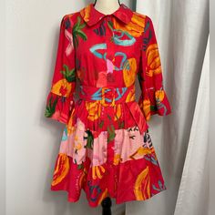 Nwt, Farm Rio Colorful Tiered Mini Dress. Flutter Sleeves Tiered Layers 100% Cotton Tropical Motifs Belt Included Button Front Closure Machine Wash Measurements Are Flat Lay And Approximate Shoulders 14.5in. Bust 19.25in. Waist 17.5in. Length 33.75in. Red Cotton Shirt Dress For Spring, Spring Vacation Red Shirt Dress, Red Shirt Dress For Spring Vacation, Dress Flutter Sleeves, Tropical Motifs, Tiered Mini Dress, Farm Rio, Shirtdress, Tiered Dress