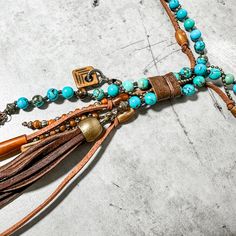 Turquoise Clutch Necklace Horn and Deerskin Tassel. Hand crafted by Amy Kaplan. Amy is a truly talented artisan who has been hand crafting high quality custom jewelry for cowgirls with discriminating taste. You'll have a unique custom piece of western jewelry that stands out from the crowd. Turquoise, golden and olive horn beads with natural horn feather shaped pendant and deerskin tassel. Western Diy Jewelry, Deer Skin, Western Jewelry, Style Jewelry, Western Style, Country Girls, Bourbon, Western Fashion, Custom Jewelry