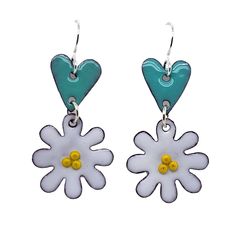 Elevate your everyday style with our whimsical Daisy Heart Earrings! These delicate and meticulously handcrafted earrings feature daisy motifs hanging below heart shapes, creating a charming and playful design. 🌼 Artistry in Every Detail: Each earring is a work of art, carefully made with attention to detail. The daisies come to life with yellow centers, and the heart-shaped design adds a touch of romance. 💫 Versatile Elegance: These earrings are perfect for any occasion, from casual brunches Whimsical Dangle Earrings With Flower Charm, Whimsical Flower Charm Earrings For Gift, Whimsical Spring Earrings With Flower Charm, Whimsical Adjustable Flower Charm Earrings, Whimsical Flower Charm Earrings, Whimsical Flower-shaped Earrings With Flower Charm, White Whimsical Spring Earrings, Whimsical Nickel Free Dangle Flower Earrings, Daisy Earrings As A Gift