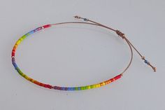 🏳️ ☆ ☆LGBTQ bracelet☆ ☆ ☆🏳️🌈 These beautiful and minimalist bracelet is made of delicate and high quality Miyuki beads. It represents the Pride flag and is perfect for any outfit. It's unisex, so anyone can wear it. Thanks to macrame slide knot it is easily adjustable and should be fit for most adults and also teens wrists, but please, don't hesitate to text me if You think You need a smaller or bigger one. It's about 14-15 cm when fully tightened and about 25 cm when expanded. ☆ ☆ ☆Waterproo Lgbtq Bracelet, Bracelet Miyuki, Bracelet Rainbow, Pride Bracelet, Miyuki Bracelet, Bohemian Accessories, Be Fit, Minimalist Bracelet, Miyuki Beads