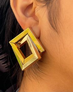 Transform your look with our captivating statement earrings - a unique pair that embodies boldness, trendiness, and modern sophistication. These dramatic dangle earrings, adorned with chic geometric designs in timeless gold, are the perfect gift, blending vintage allure with contemporary elegance, and adding a touch of glamour to any occasion *FEATURES* - Size: 5.1cm x 4.5cm - Weight: 20.7g - 100% Hypoallergenic - Lead and nickel free  - Comes with jewelry box and pouch - Tarnish free - Free delivery *CARE* - Please avoid exposing your jewelry to water. - Keep them away from any oils, lotions or perfumes. - Remove before working out and at bedtime. *SHIPPING* Order Processing: Orders are shipped out same day if ordered before 2pm EST. Orders after 2pm EST are shipped the next day.  Standar Yellow Metal Hoop Earrings For Pierced Ears, Modern Yellow Earrings For Party, Elegant Yellow Metal Earrings, Modern Yellow Single Earring, Modern Clip-on Earrings For Party, Modern Clip-on Party Earrings, Modern Party Clip-on Earrings, Rectangular Metal Earrings For Party, Yellow Metal Drop Earrings