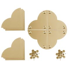 four pieces of gold metal with hearts and flowers