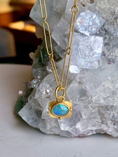 Opal 22k Gold Pendant Necklace.   Australian Opal in vibrant blue greens with purple flashes makes this stunning pendant a future keepsake heirloom. This solid Opal, it is not a doublet,  is wrapped in a solid 22k Gold bezel and back and is decorated with 22k Gold granulation beads.  This listing is for the pendant only. It is also available with the pictured 22k Gold handmade chain. Please inquire. 22k Gold Earrings, 22k Gold Ring, Green Opal, Semi Precious Stone, Australian Opal, Jewelry Designer, Opal Pendants, Gold Pendant Necklace, 22k Gold