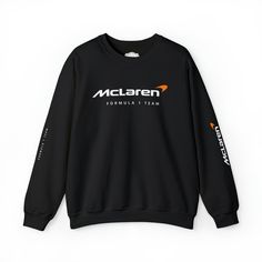 Formula 1 Sweatshirt | McLaren Racing Formula 1 team | Unisex Crewneck Sweatshirt Ideal for any situation, a unisex heavy blend crewneck sweatshirt is pure comfort.  ✅ Made from polyester and cotton - This combination helps designs come out looking fresh and beautiful.  ✅ The collar is ribbed knit, so it retains its shape even after washing. There are no itchy side seams on these sweaters.  ✅ Made with a medium-heavy fabric blend of 50% cotton and 50% polyester, this sweatshirt feels cozy and is Sports Season Crew Sweatshirt With Logo Print, Sports Season Logo Print Crew Sweatshirt, Black Crew Sweatshirt With Team Spirit, Crew Neck Sweatshirt With Logo For Sports Season, Black Crew Sweatshirt For Team Spirit, Black Crew Neck Sweatshirt With Team Spirit, Crew Cotton Sweatshirt With Team Logo, Crew Sweatshirt With Logo Print For Sports Events, Crew Neck T-shirt With Team Name