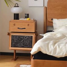 a bedroom with a chalkboard on the nightstand