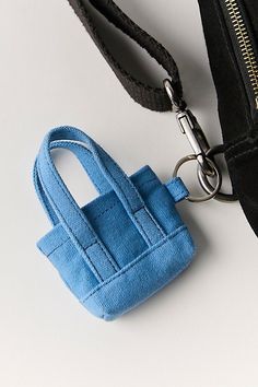 Add the cutest finish to your bags collection with this mini canvas bag keychain featured in a classic silhouette and structured design for a truly timeless touch. | Mini Caravan Bag Charm by Free People in Blue Mini Pouch Keychain, Crochet Mini Bag Keychain, Small Everyday Bags With Interior Key Chain Holder, Blue Bag With Interior Key Chain Holder For Gift, Rectangular Bag With Key Clip For Daily Use, Plush Craft, Mini Caravan, Tiny Bags, Crochet Mini Bag