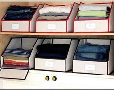 an organized closet filled with folded clothes and storage bins on the bottom shelf next to drawers