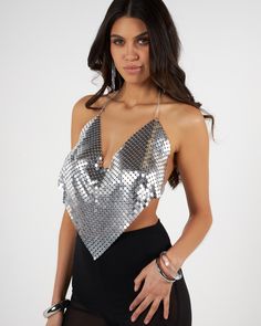 Silver shiny chainmail V-neck top Glamorous Metallic Tops For Club, Glamorous Metallic Club Tops, Glamorous Sequined Mesh Top For Party, Glamorous Party Mesh Top With Sequins, Glamorous Mesh Top For Party Season, Silver Sequined Crop Top For Club, Silver Disco Top For Evening, Silver Tops For Club And Party Season, Elegant V-neck Mesh Top For Party