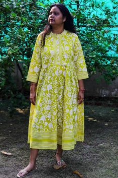 Yellow Floral Printed  Anarkali / A-line/ Maxi Dress for Women / Anarkali Kurta Women The set contains : 1 A-line kurta/ Maxi Dress /Gown   Our Yellow printed Anarkali kurta, crafted in sumptuous Pure Cotton fabric features a notched neckline with handmade fabric buttons on the yoke,  and three - quarter bishop sleeves. ldeal for work and beyond. Model Size & Fit The model (height 5'8) is wearing a size S Material & Care Pure Cotton Gentle Machine Wash Please see the photo section to choose best Eid Anarkali Tunic Dress, Traditional Dresses With Printed Motifs, Bohemian Long Sleeve Anarkali Set For Summer, Summer Bohemian Long Sleeve Anarkali Set, Spring Festive Anarkali Maxi Dress, Summer Floral Print Straight Kurta Anarkali Set, Cotton Tunic Dress For Eid, Summer Floral Print Anarkali Set With Straight Kurta, Summer Floral Anarkali Set With Straight Kurta