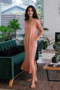 When casual chic comfort calls, the Sloane V-Neck Cap Sleeve Bamboo Maxi Dress answers. This loose-fitting t-shirt dress is more flattering than one might expect for its simplicity, or maybe that's the extra radiance you exude from being so wonderfully uninhibited. Chaise lounge optional, but highly recommended. Loose fit, cap sleeve, pockets at hip, V-neck, hem lands at mid-calf. Maxi Dress Sale, Eco Friendly Clothing, Lounge Dress, Sleeve Maxi Dress, Capped Sleeve Dress, Womens Size Chart, Maxi Dress With Sleeves, Black Maxi Dress, Cap Sleeve