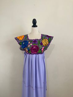 "Gorgeous hand made dress with front and back embroidered! This garment slips over the head. Our garments are one of a kind pieces, thus may have imperfections that are unique to it's handcrafted nature!! ONE SIZE: Fits sizes M/L/XL Pit arm to pit arm: 17\" to  21\" Long: 64\" CARE DETAILS: Hand wash or delicate only Hang to dry Thank you for visiting my store and have a wonderful day!" Peasant Style Embroidered Dress For Festival, Peasant-style Embroidered Dress For Festival, Peasant Style Festival Dress With Embroidered Border, Peasant Dress With Embroidered Border For Festival, Peasant Dress With Intricate Embroidery For Festival, Peasant Festival Dress With Intricate Embroidery, Peasant Style Multicolor Embroidered Festival Dress, Multicolor Embroidered Festival Dress With Embroidered Neckline, Handmade Bohemian Dresses With Multicolor Embroidery