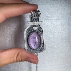 Amethyst necklace, potion bottle necklace, amethyst pendant, amethyst jewelry, fabricated pendant, sterling silver, ooak crystal necklace by ZebaJewelry on Etsy https://www.etsy.com/listing/763222488/amethyst-necklace-potion-bottle-necklace Potion Bottle Necklace, Necklace Amethyst, Bottle Necklace, Potion Bottle, Amethyst Jewelry, Amethyst Necklace, Amethyst Pendant, February Birth Stone, Birthstone Jewelry