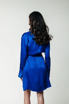 The oh-so classy Dorin Satin Wrap Dress in vibrant blue has been flying off of our shelves. It's gorgeous shiny fabric with side wrap detail feels amazing and looks stunning on everyone that wears it. Grab this wrap-dress while you still can. Perfect for the holiday season or to knowck their socks off at work, a date night, or dinner with friends. Wrap dress 100% Polyester Hand wash cold, do not tumble dry, lay flat to dry, iron at low temperature or dry clean Regular fit Wrap closure Delicate i Silk V-neck Wrap Dress For Night Out, Blue Long Sleeve Wrap Dress For Formal Occasions, Formal Long Sleeve Blue Wrap Dress, Blue Wrap Dress With Surplice Neckline For Formal Occasions, Blue Formal Wrap Dress With Surplice Neckline, Blue Wrap Dress With Surplice Neckline For Party, Fitted Silk Wrap Dress For Night Out, Blue Party Wrap Dress With Surplice Neckline, Sleek Blue Dress For Night Out