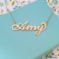 Order any name for your solid 14K gold Dylan style nameplate necklace!! A great personalized custom made gift for any occasion!! Birthday, Graduation Or any Holiday! *Both the nameplate and chain are all solid 14k gold. *Stamped for authenticity 14K. *1.0 cm tall first capital letter. *This listing is for one (1) name with one (1) capital letter only! *Names that are put in all capitals will be made like the sample photo. *The nameplate Is .8mm high quality thickness. *In the photo you can view Amy Name, Nameplate Necklace Gold, Nameplate Necklace, Gold Name Necklace, Personalized Pendant, Name Jewelry, Yellow Gold Pendants, Name Plate, Chain Pendants