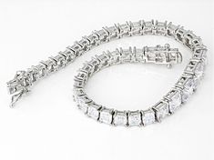 Bella Luce® white diamond simulant 25.16ctw square asscher cut rhodium over sterling silver tennis bracelet. Measures approximately 7.50"L x 0.31"W with hidden box clasp. The diamond equivalent weight is 15.24ctw. Rectangular Diamond Cut Tennis Bracelet, Formal Rectangular Diamond Tennis Bracelet, Silver Rectangular Diamond Bracelet With 17 Jewels, Luxury Silver Rectangular Tennis Bracelet, Formal Silver Diamond Bracelet With Rectangular Shape, Rectangular Silver Diamond Bracelet For Formal Occasions, Formal White Gold Tennis Bracelet With Rectangular Shape, Formal Silver Rectangular Diamond Bracelet, Formal White Gold Rectangular Tennis Bracelet