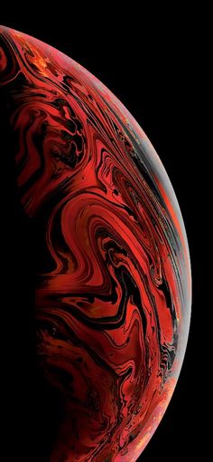 a red and black background with swirls in the center, on top of an iphone