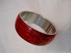 Stunning Marbled Shimmery Red Faux Crocodile Leather and Alpaca Silver Metal Bangle Bracelet. The Line that you see on that bangle photos is the alpaca metal bangle band setting bonded. This Stunning Unique Bangle is from my own vintage bangle collection. It is in excellent unworn vintage condition. Luxury Red Statement Bangle, Luxury Adjustable Red Bangle, Bangle Collection, Unique Bangle, Vintage Bangles, Crocodile Leather, Bracelet Vintage, Bangle Bracelet, Alpaca