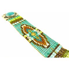 Chili Rose Beaded Turquoise & Gemstone Bracelet by Adonnah Langer of Santa Fe, New Mexico Gorgeous Diana Bracelet features a Southwestern blend of turquoise, olive green and red Swarovski beads handcrafted with a true artistic mix of beads and a canvas of gorgeous colors. Gorgeous Turquoise Oval Medallions Grace the ends of this woven beaded bracelet *Measures 6 3/4 inches to 7 1/2 inches- please specify (made to order) *Medallion measures 1 1/4 inch x 7/8 inch *Sterling Silver .925 *Hidden Lock Artisan Green Handmade Bracelets, Artisan Green Bracelets With Spacer Beads, Handmade Artisan Turquoise Bracelets, Handmade Southwestern Green Beaded Bracelets, Artisan Green Beaded Bracelets, Artisan Green Beaded Bracelets With Round Beads, Handmade Green Southwestern Beaded Bracelets, Artisan Turquoise Beaded Bracelets Adjustable, Handmade Southwestern Green Bracelets