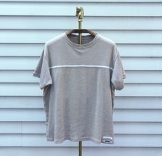 "- Trendy aesthetic vintage late 1990s basic midweight ribbed cream beige casual tshirt with classic white mid chest trim detail by Forenza - No tag, material unknown, but likely 100% cotton or cotton blend - Size unknown, likely XL, refer to measurements - 50\" bust | 25.5\" long | 7\" sleeve high school, 90's, skater, mom, momcore, basic, neutral, casual, cute, zoomer, gen x, gen z, millennial, coastal, beach, beachy, midwest, emo, indie, grunge, knit, 90s, fall, autumn" Ribbed Short Sleeve Top For Streetwear, Ribbed Cotton T-shirt For Streetwear, White Ribbed Tops For Streetwear, Ribbed Crew Neck T-shirt For Streetwear, Casual Ribbed T-shirt For Streetwear, Ribbed Short Sleeve T-shirt For Streetwear, Relaxed Fit Ribbed Tops For Streetwear, Classic White Ribbed T-shirt, Beige Ribbed Cotton Top