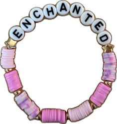 a pink and white beaded bracelet with the word enchanted written on it