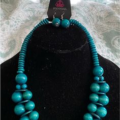 Teal Wooden Beaded Necklace With Complimentary Earrings. Casual Turquoise Jewelry With Wooden Beads, Casual Blue Necklace With Colorful Beads, Blue Wooden Beads Round Jewelry, Casual Blue Beaded Necklaces With Large Beads, Blue Wooden Beaded Round Jewelry, Blue Wooden Round Beads Jewelry, Casual Blue Beaded Necklace With Large Beads, Trendy Blue Jewelry With Large Beads, Blue Necklace For Summer Parties