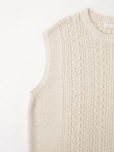 Editor's NotesWomen Reversed Cable Knit Vest Cream from KNITLY is a semi-overfit knit vest product. It was woven into a cable pattern. It has a ribbed neckline and ends. It can be worn alone or layered with a t-shirt.- Semi-over fit- Round neck- Ribbed details- High quality stitchesMeasurements (in.)- 0- Length: 20.0 in.- Shoulder: 12.5 in.- Chest: 18.1 in.- Arm hole: 9.4 in.*Model Information- Height: 5'7 Waist: 23.6 Size: 0Composition & Care- 85% Cotton, 15% Flax- Dry Clean OnlyDesigner- by KNITLY Cable Knit Vest, Cable Pattern, Ribbed Neckline, Knit Vest, Cable Knit, Round Neck, Cable, Wardrobe, Cream