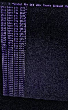 an old computer screen with purple text on it