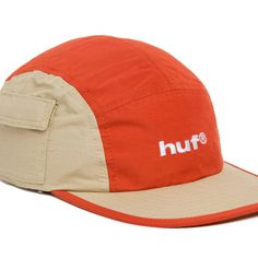 an orange and beige hat with the word huf on it's side, in white