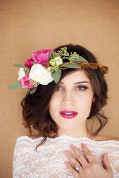 a woman wearing a flower crown on her head