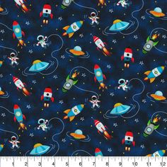 a blue background with small rockets and stars on it, as well as an outer space theme