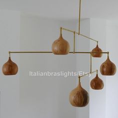 a wooden light fixture hanging from the ceiling