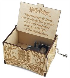 a wooden music box with harry potter quote on the front and back side, open