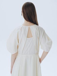 This is a modern and unique dress by ahwe that is made out of high quality and sturdy fabric. With minimal design detail and trendy mood, you can style it for your casual and refined daily outfit.- Voluminous lantern sleeves- U neckline with shirring- Dart detail on the sleeves- Diagonal pleat and cutout detail on the back Cotton Mini Dress With Puff Gathered Sleeves, Spring Daywear Puff Sleeve Dress With Bishop Sleeves, Spring Puff Sleeve Dress With Bishop Sleeves For Daywear, Summer Voluminous Dresses With Bishop Sleeves, Daywear Dress With Bishop And Blouson Sleeves, Cotton Puff Sleeve Dress With Gathered Sleeves For Brunch, Cotton Puff Sleeve Dress For Brunch With Gathered Sleeves, Cotton Mini Dress With Balloon Sleeves, Spring Cotton Puff Sleeve Dress With Lantern Sleeves