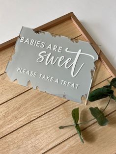 there is a sign that says babies are sweet please take a treat on the floor