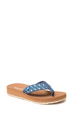 A cushioned footbed and thick rubber sole lend comfortable support to a stylish flip-flop secured with a center toe post. Cushioned footbed Textile upper and lining/rubber sole Imported Casual Toe Post Flip Flops With Ortholite Insole, Casual Slippers With Ortholite Insole And Toe Post, Adjustable Blue Flip Flops With Arch Support, Adjustable Blue Flip Flops With Textured Footbed, Stylish Flip Flops, Light Blue Denim, Flip Flop, Rubber Sole, Blue Denim