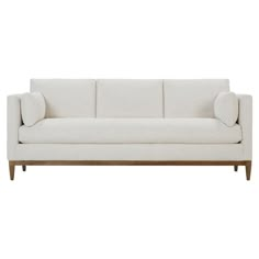 a white couch sitting on top of a wooden frame