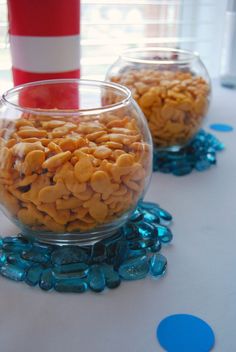 two glass bowls filled with cereal on top of a table