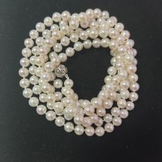 Fine Quality Japanese Saltwater Akoya Pearl Diamond Necklace 49" 18k White Gold 7 mm Certified $5,950 307927This is a One of a Kind Unique Custom Made Glamorous Piece of Jewelry!Nothing says, "I Love you" more than Diamonds and Pearls!This item has been Certified, Inspected, and Appraised by Gemological Appraisal LaboratoryGemological Appraisal Laboratory of America is a proud member of:- GIA Alumni Association- National Association of Jewelry Appraisers- International Consortium Gem-Testing Lab Classic Jewelry With Diamond Cut Round Beads, Formal Long Single Strand Pearl Necklace, Timeless Round Jewelry With High Luster, Formal Single Strand Round Necklace, Formal Single Strand Long Necklace, Formal Long Single Strand Necklace, White Gold Round Pearl Necklace With High Luster, Formal White Gold Long Necklace, Formal Long White Gold Necklace