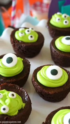 some cupcakes with green frosting and googly eyes