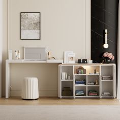 a room with a desk and shelves in it