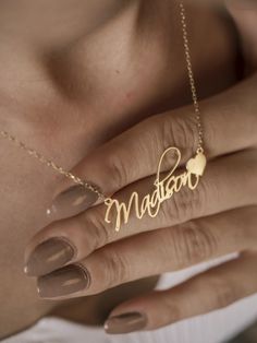 Imagine a necklace that holds a special place in your heart. Our personalized 14k gold name necklace offers a unique and meaningful way to express your love and affection. This exquisite piece, adorned with your chosen name, is a testament to the bond you share with a loved one. Whether it's a gift for a special occasion or a cherished keepsake for yourself, this personalized necklace is a symbol of enduring love and connection. Features and Benefits ✅ Customizable with your desired name ✅ Crafted from high-quality 14k gold ✅ Elegant and timeless design ✅ Suitable for daily wear ✅ A perfect gift for any occasion ✨-- M A T E R I A L S & F I N I S H --✨ ✅ Crafted from high-quality 925 sterling silver with a 14k gold micron plating or in solid 14k gold. ✅ Available in Rose Gold, White Gold, a Gold Double Heart Name Necklace, Gold Heart Nameplate Necklace, Gold Double Heart Name Necklace As Personalized Gift, Gold Nameplate Heart Necklace, Gold Double Heart Name Necklace For Personalized Gift, Personalized Gold Name Necklace With Double Heart, Personalized Gold Double Heart Name Necklace, Customizable 14k Gold Necklaces For Anniversary Gift, Elegant Custom Name Heart Necklace For Anniversary