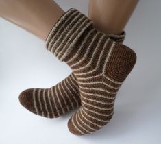 Unisex Crochet Slipper Boots, soft and durable wool/linen socks, bed socks. Made of merino wool/ linen/tweed yarn, crochet socks are soft and durable make your feet feel warm and cozy. Designed and made by me, these socks can be a nice gift for those who can appreciate high quality of CROCHET socks. The pairs on the photo fit a EU size 39/40 (US 7/7,5  M). The length of the sock from toe to heel is 25-26 cm and width ~11 cm. If you have any questions or an idea for a custom order, please feel free to message me! Take a look at other items to find more crochet handmade pieces: https://www.etsy.com/shop/CrochetFromAntonina?ref=seller-platform-mcnav I combine shipping costs for ordering more than 1 item from my shop, please write a message before placing an order. Tweed Yarn Crochet, Unisex Crochet, Crochet Slipper Boots, Crochet Slipper, Tweed Yarn, Bed Socks, Crochet Socks, Striped Socks, Crochet Slippers