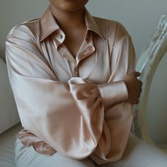 This handmade silk blouse is made in Los Angeles features black pearl buttons, a split back collar and oversized flouncy sleeves for a minimalist yet dramatic effect. The soft rose gold color doesn't wash out the wearer and provides a chic elegance for both men and women. Fit is typically true to size on a S, M, L scale.  I started this micro label as a social experiment to provide gender neutral clothing that still has style and sophistication rather than just over sized T-shirts and sweats (nothing against them) but I prefer clothes with more attention to detail and hope others do too. This shirt was inspired by one worn by Princess Margaret in the early seasons of the Crown on Netflix. Flouncy Sleeves, Gender Neutral Clothing, Neutral Clothing, Gender Neutral Style, Gender Neutral Clothes, Silk Blouses, Social Experiment, Princess Margaret, Soft Rose